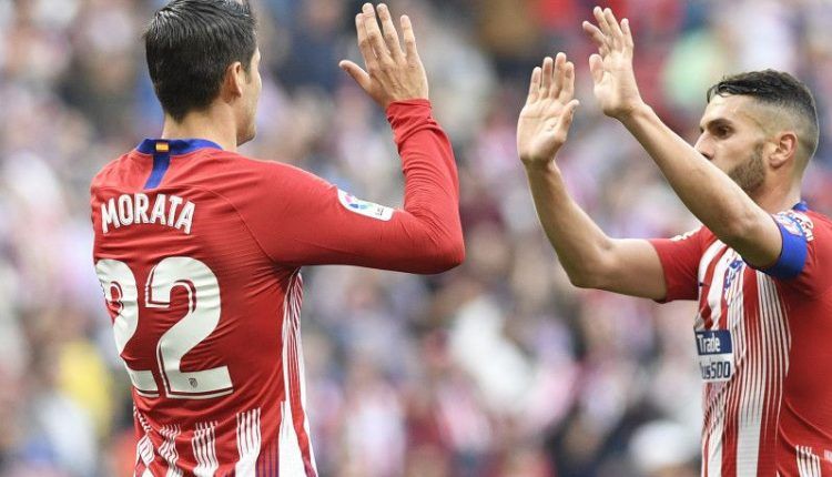 Morata y Saúl celebran un gol