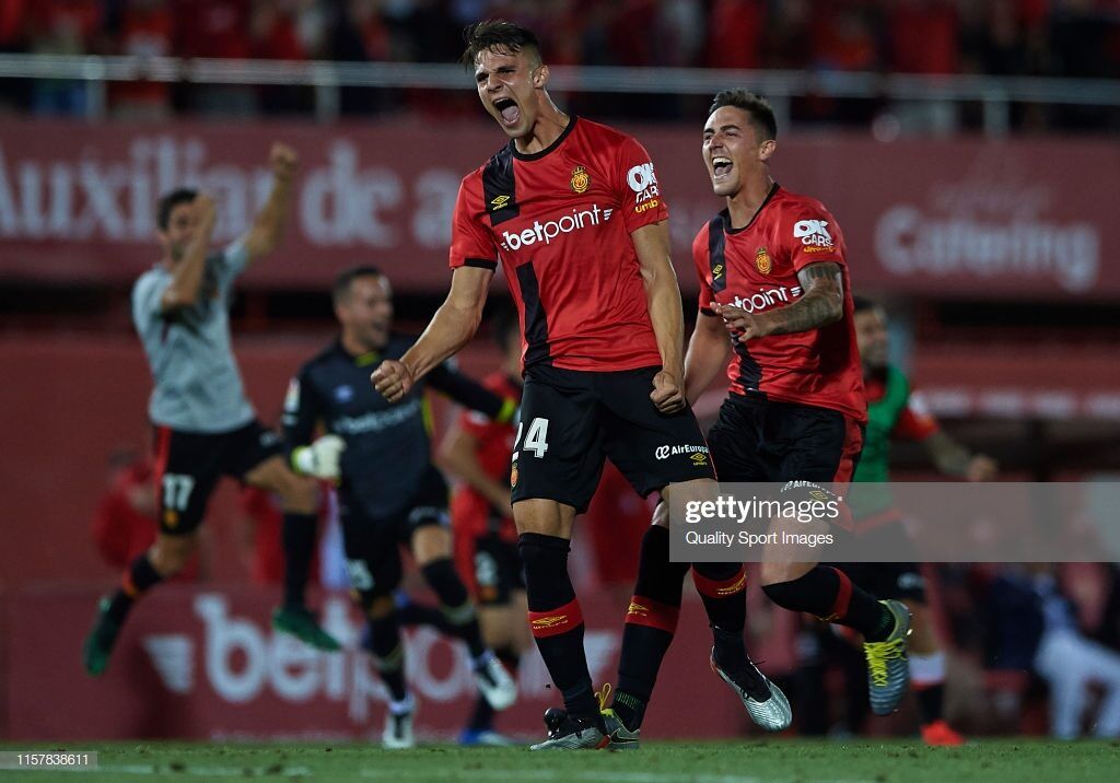 Martin Valjent of Mallorca and Antonio Raillo of Mallorca celebrate after winning during the play off second leg match between Deportivo