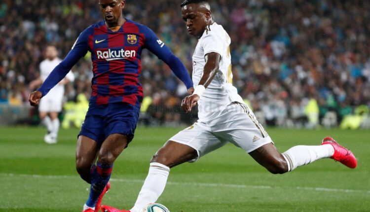 Vinicius tira a puerta ante Nélson Semedo en un Real Madrid Club de Fútbol - Fútbol Club Barcelona. Foto: Real Madrid Club de Fútbol.