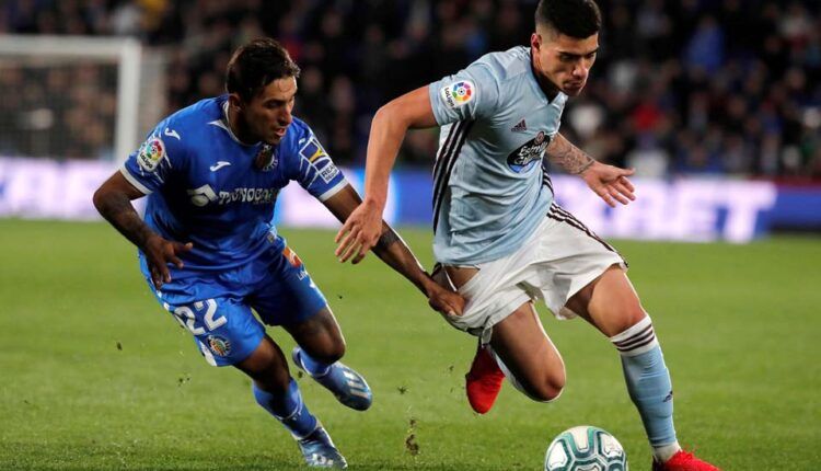 Lucas Olaza en el partido frente al Getafe frente a Damián Suárez